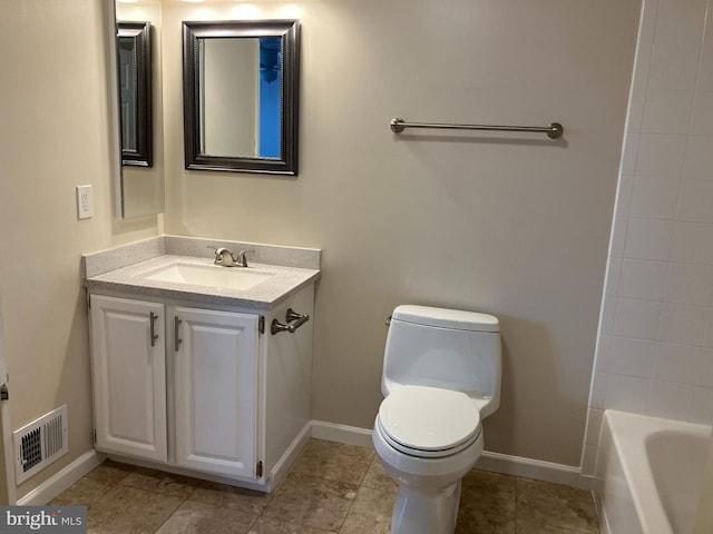 bathroom with toilet and vanity