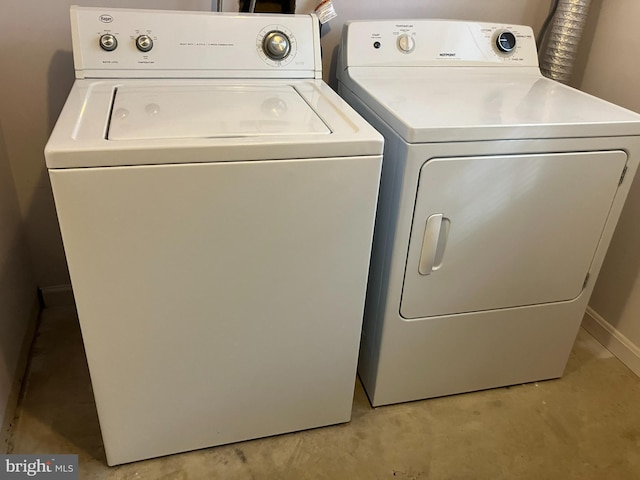 laundry room with separate washer and dryer