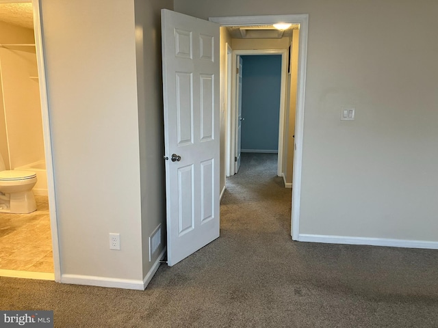 corridor featuring carpet flooring