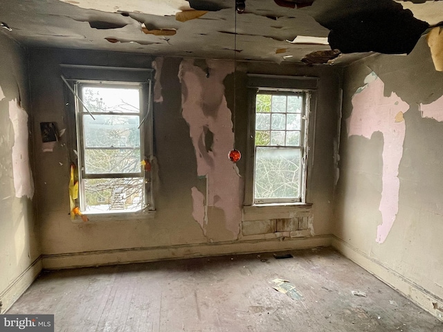 misc room with light wood-type flooring and a wealth of natural light