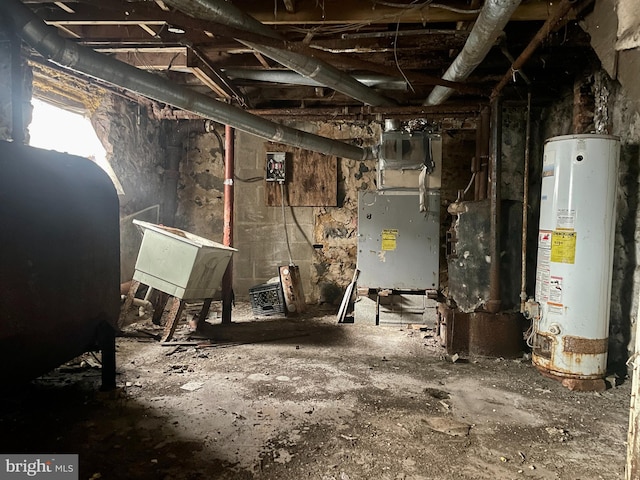 basement with sink, heating unit, and gas water heater