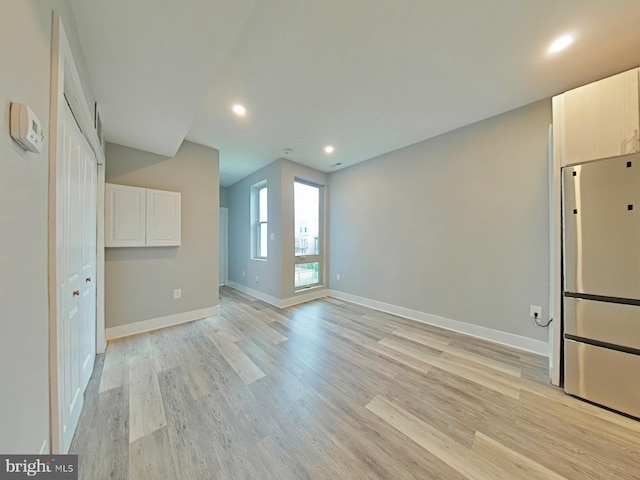 unfurnished room featuring light wood-type flooring