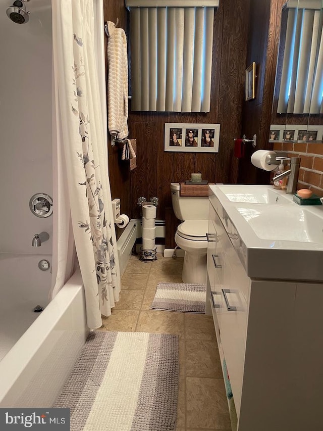 full bathroom featuring tile patterned floors, toilet, vanity, and shower / bath combo