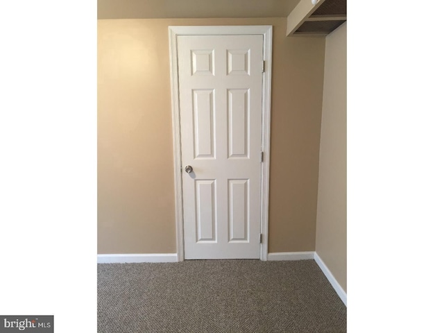 hallway with carpet