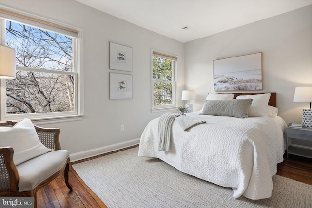 bedroom with hardwood / wood-style floors