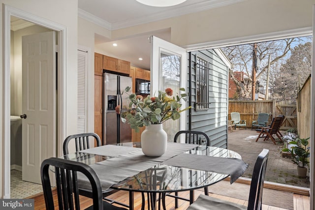 dining room featuring crown molding