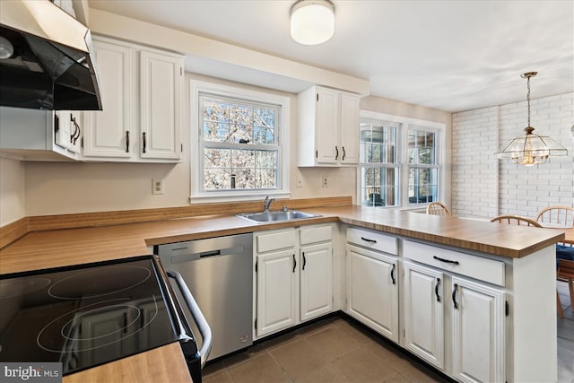 kitchen with range with electric stovetop, a sink, dishwasher, a peninsula, and extractor fan