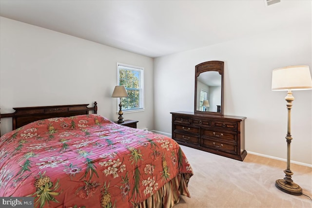 bedroom featuring carpet floors and baseboards