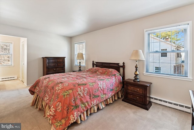 carpeted bedroom with a baseboard heating unit