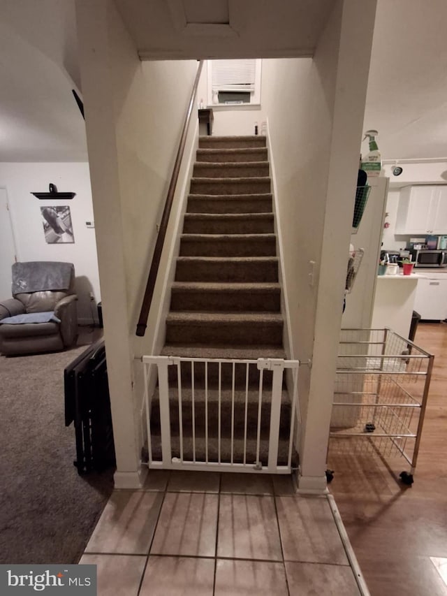 stairs with wood finished floors