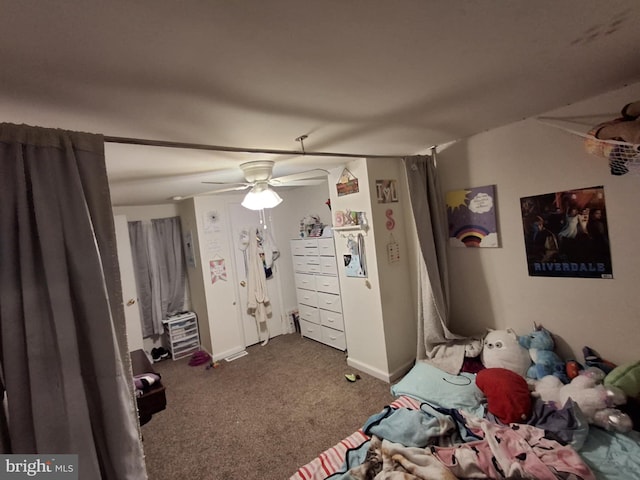 carpeted bedroom with a ceiling fan and baseboards