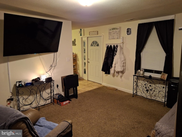 living room with carpet, visible vents, and baseboards