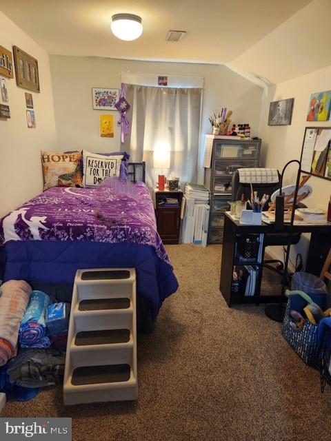 carpeted bedroom with visible vents