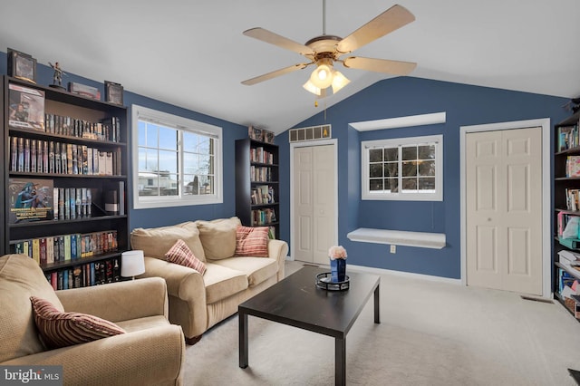 carpeted living room featuring lofted ceiling and ceiling fan