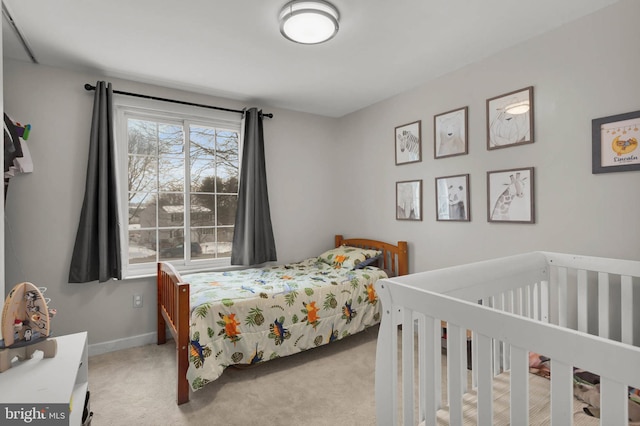 bedroom with light colored carpet