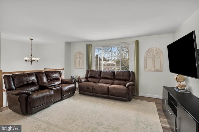 living room featuring hardwood / wood-style floors and a notable chandelier