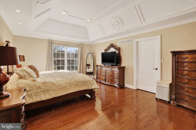 bedroom with crown molding and wood-type flooring