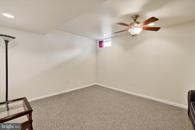 unfurnished room featuring ceiling fan and carpet flooring