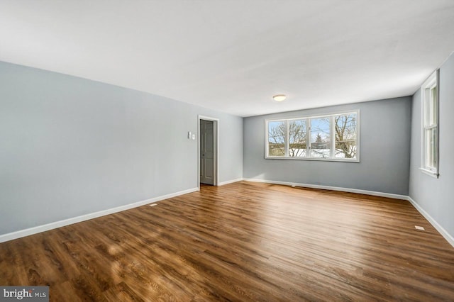 spare room with wood-type flooring