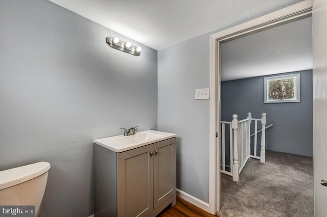 bathroom with toilet and vanity