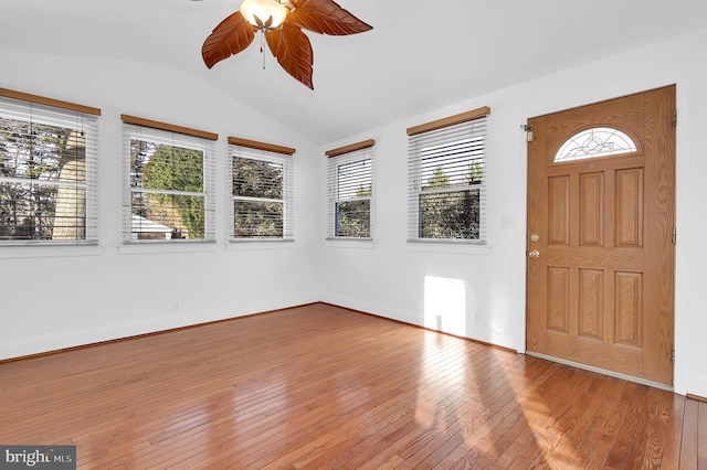 foyer entrance with wood-type flooring, lofted ceiling, and ceiling fan