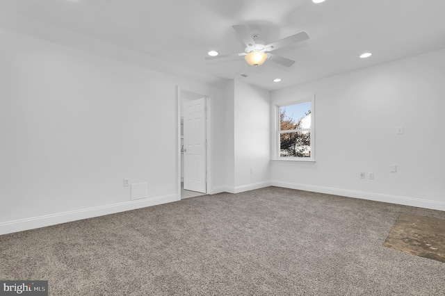 carpeted empty room featuring ceiling fan