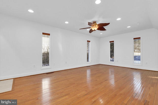 spare room with ceiling fan and light wood-type flooring