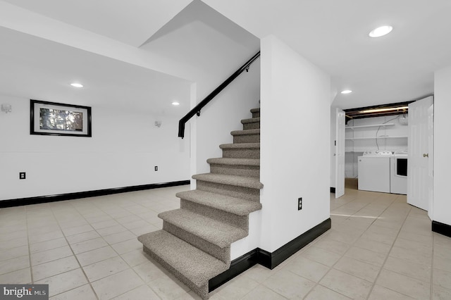 staircase featuring tile patterned flooring and independent washer and dryer