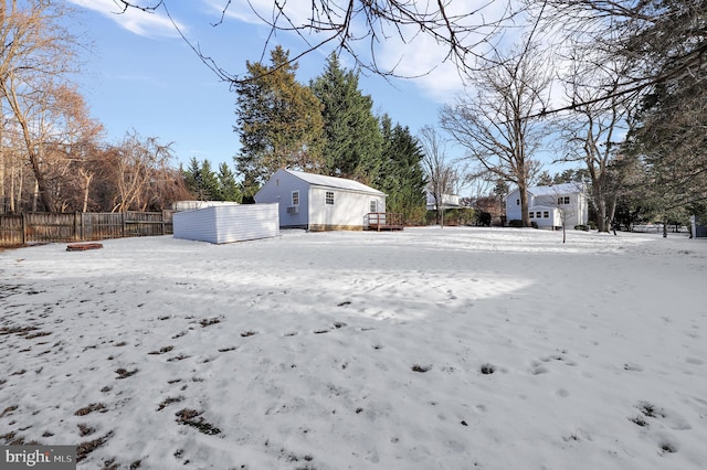 view of yard layered in snow