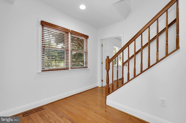 entrance foyer with light hardwood / wood-style flooring