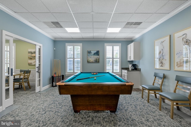 recreation room featuring dark colored carpet, pool table, a drop ceiling, and ornamental molding