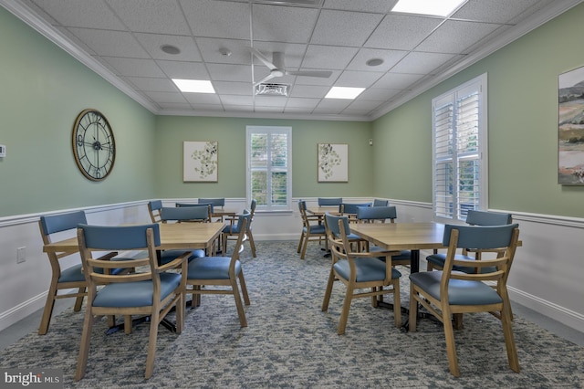 dining space featuring a wealth of natural light, carpet flooring, a paneled ceiling, and crown molding