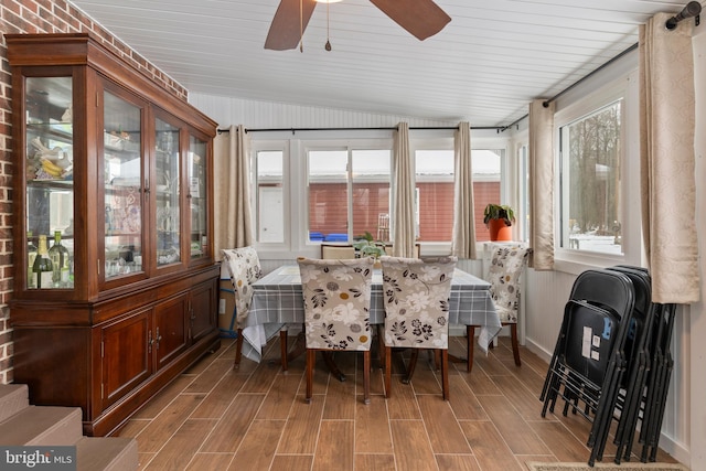 sunroom featuring ceiling fan