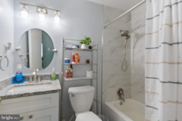 full bathroom featuring toilet, vanity, and shower / bath combination with curtain