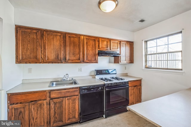 kitchen featuring gas stove, black dishwasher, and sink