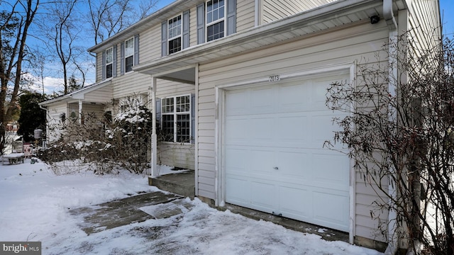 view of snow covered garage