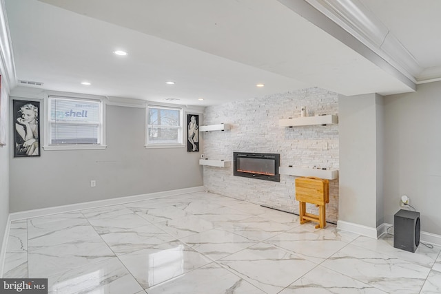 interior space featuring a stone fireplace and ornamental molding