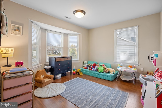 rec room with hardwood / wood-style floors