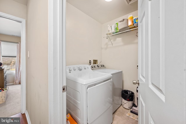 washroom with washer and dryer