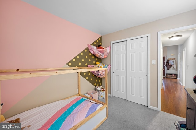 carpeted bedroom featuring a closet