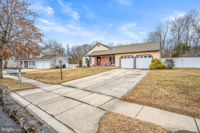 ranch-style house with a garage and a front lawn