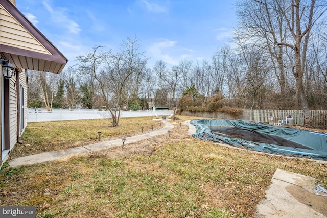 view of yard featuring a covered pool