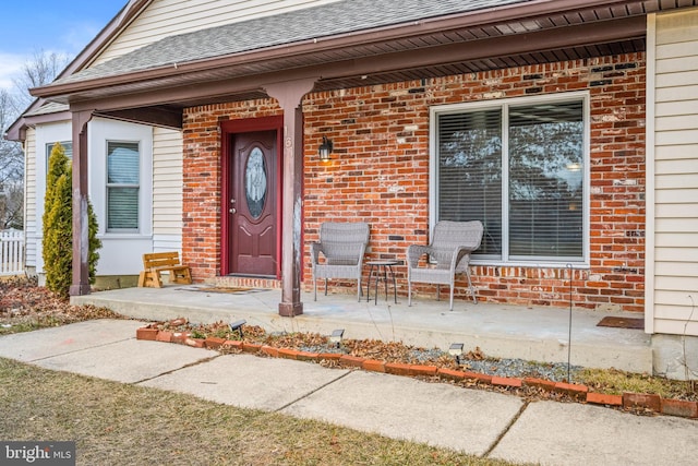 property entrance with covered porch