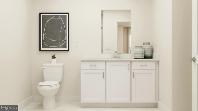 bathroom featuring toilet and vanity