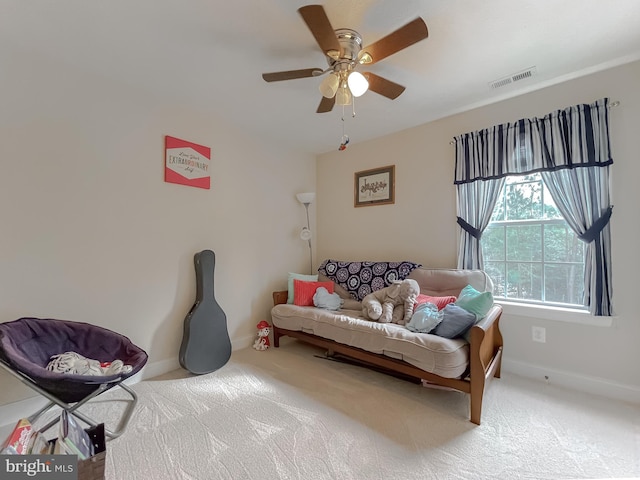 sitting room featuring carpet floors and ceiling fan