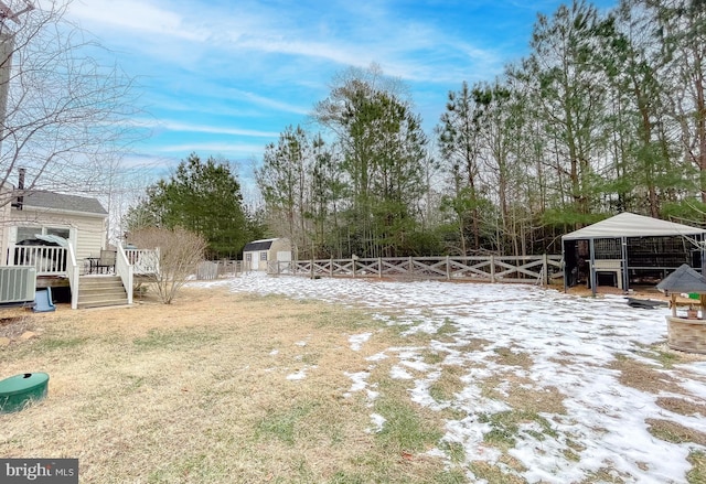 view of yard with cooling unit and a storage shed