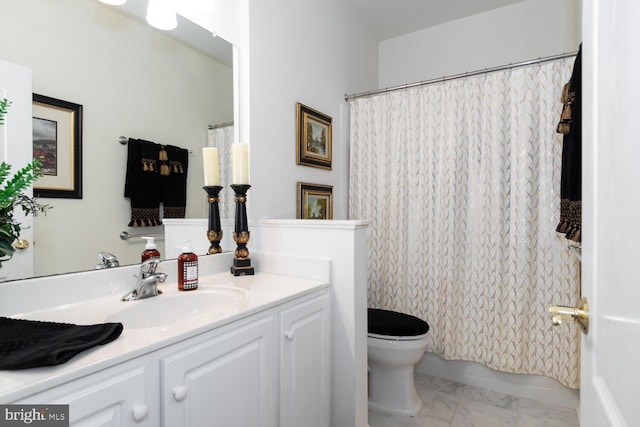 bathroom featuring toilet, walk in shower, and vanity