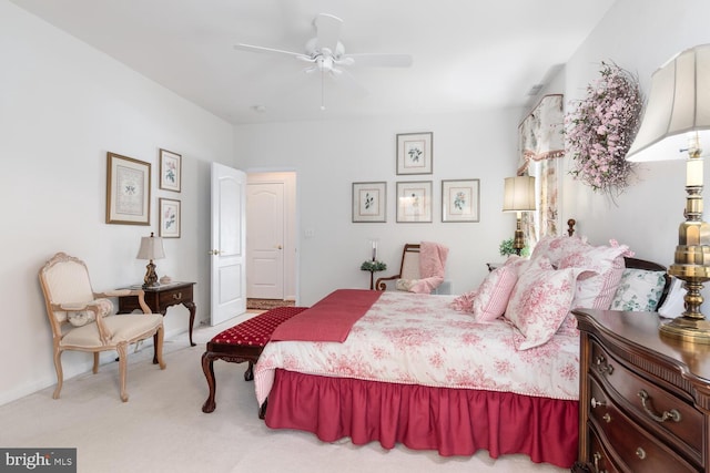 bedroom featuring light carpet and ceiling fan