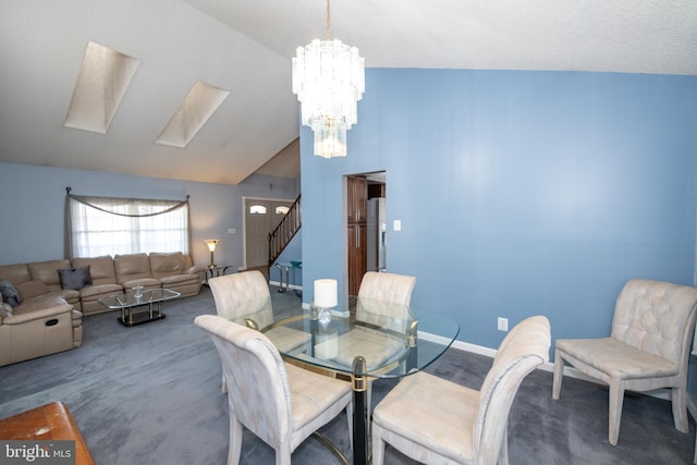 dining area featuring vaulted ceiling, a chandelier, and dark colored carpet