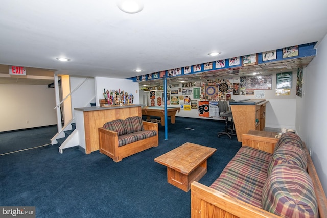 recreation room with bar and dark colored carpet